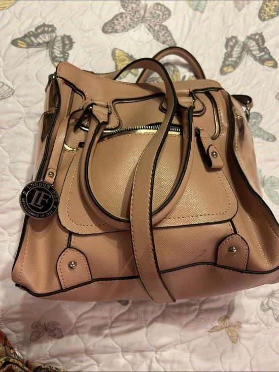 London Fog shoulder bag. Black trip.  Casual bag and ready to dress up.