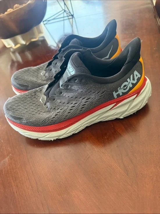 Hoka Men's Gray and Black Running Sneakers with Red and Yellow Accents