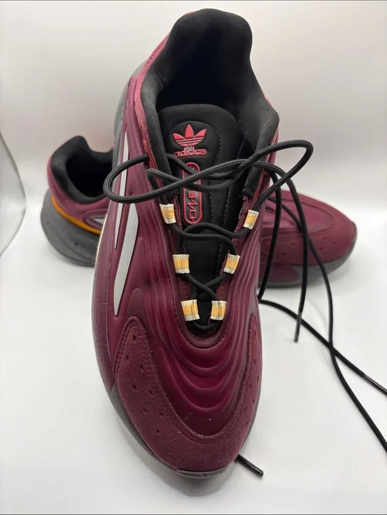 adidas OZELIA Men’s Burgundy and Black Running Sneaker with Yellow Accents