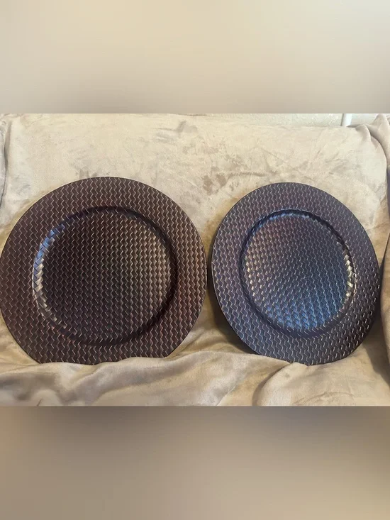 Set of 2 metallic brown plate chargers.