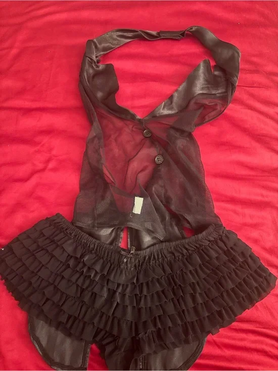 Black ruffled lingerie set with ruffed panty and sheer top.  Top i