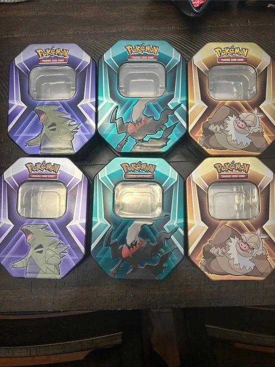 Trading Card Game Tin - Purple, Teal, and Gold.  Tons are empty
