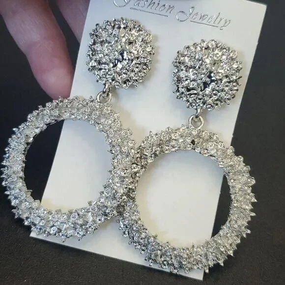 Silver tone circular themed statement earrings texture chunky