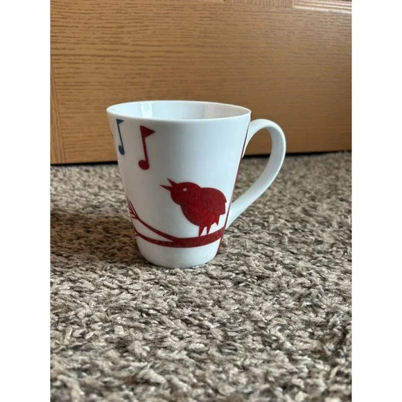 2012 Starbucks Mug with Bird Sitting on a Limb Singing Red & Blue Notes