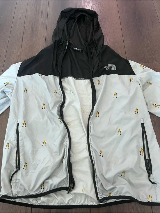 The North Face Black & Light Gray Hooded Windbreaker with Yellow Motif