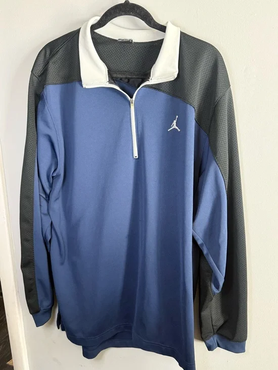 This is a blue and black Nike Air Jordan quarter-zip warmup jacket size XL