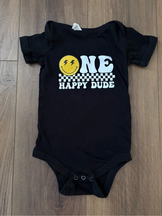 Bella Canvas Black Baby One-Piece with Yellow Smiley and White Graphic