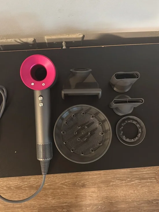 Dyson Hair Dryer with Pink and Gray Styling Attachments
