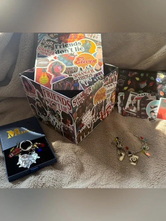 Stranger Things Sticker Storage Box – Multicolor Fans Edition with other items