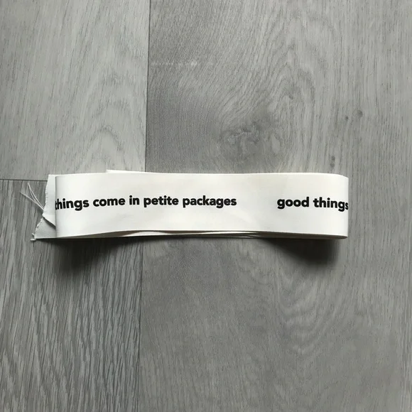 White Decorative Ribbon with Black Text - 'good things come in petite packages'