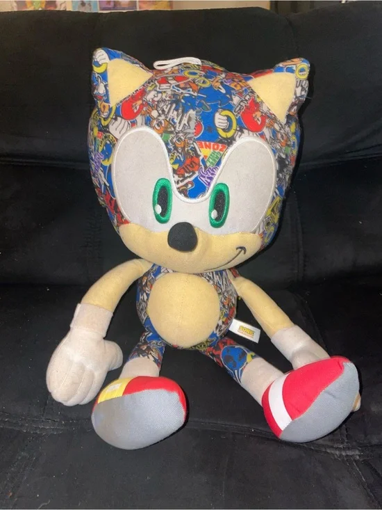 Plush Character Toy in Blue Multicolor Print with Red Shoes