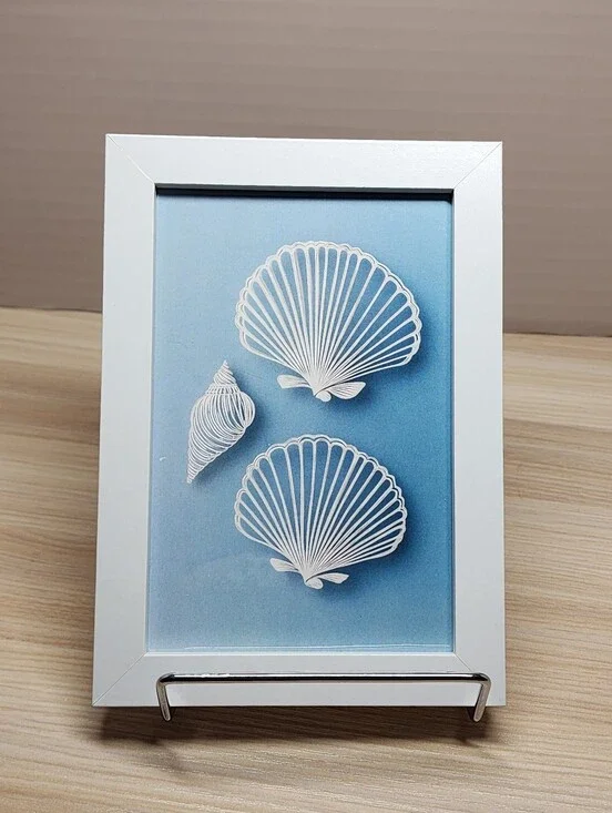 Coastal Shell Wall Art - White Frame, Blue Background