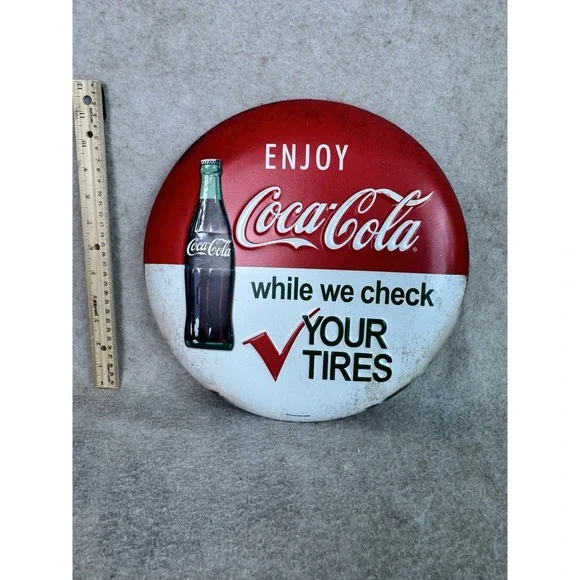 Enjoy Coca-Cola While We Check Your Tires Embossed‎ Metal Button Sign