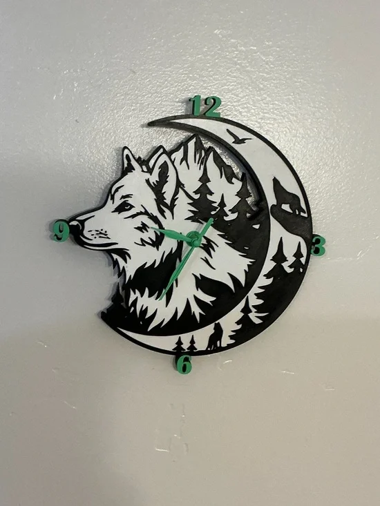 Wolf Moon Black and White Wall Clock with Green Accents