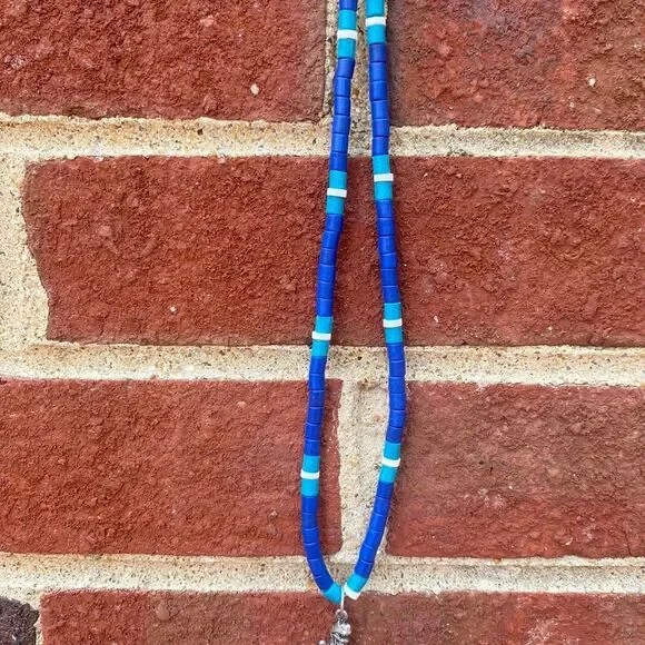 y2k Pukka shell inspired dinosaur necklace