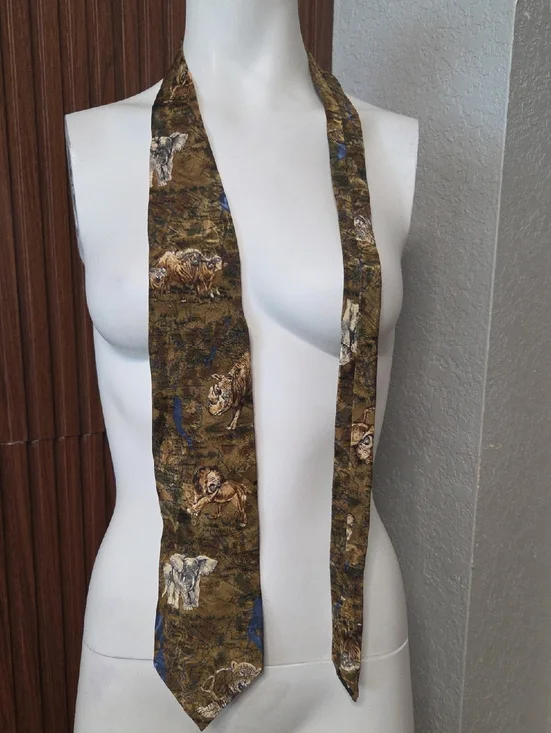 African Big 5 themed silk tie featuring an animal print pattern.