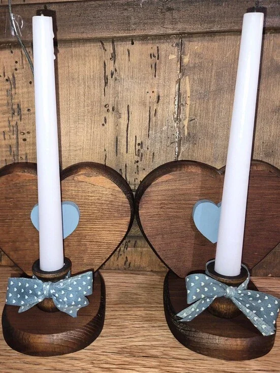 Set of handmade rustic wooden heart candle holders featuring blue heart accents
