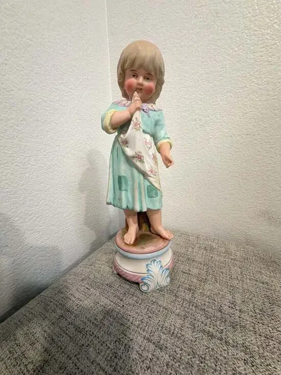 Antique German Bisque Porcelain Figurine Young Girl in Bonnet Holding Cloth