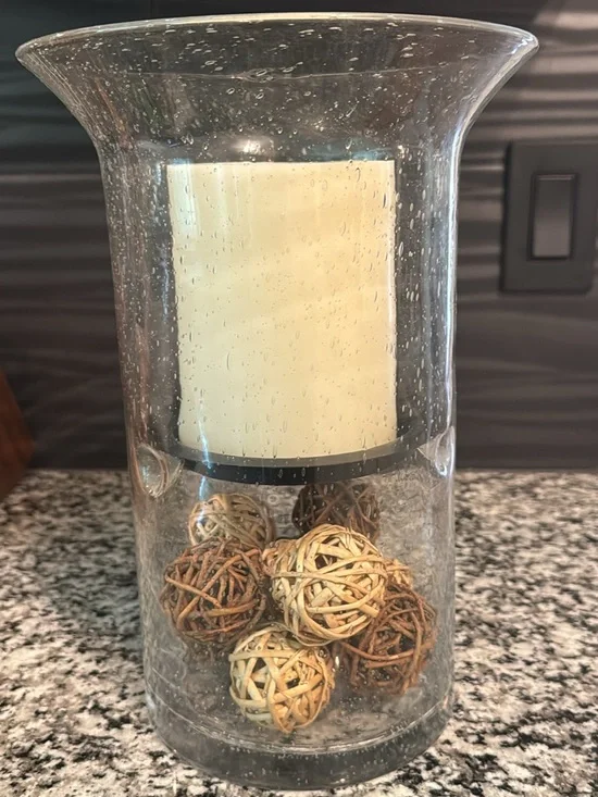 Clear Glass Hurricane Vase with Ivory Candle and Decorative Rattan Balls