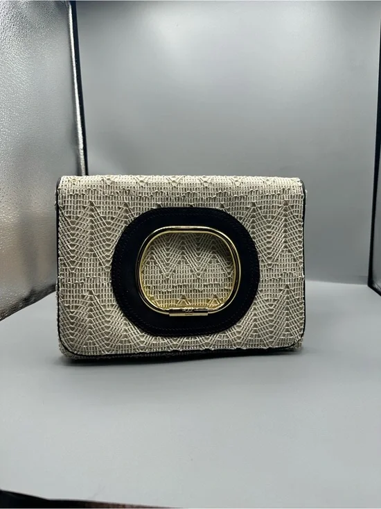 BCBG Cream Woven Clutch with Black Trim and Gold Accent