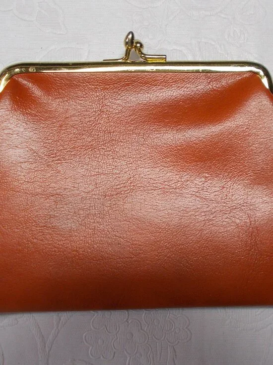 Vintage leather orange/rust color coin/wallet/pouch with gold-color snap