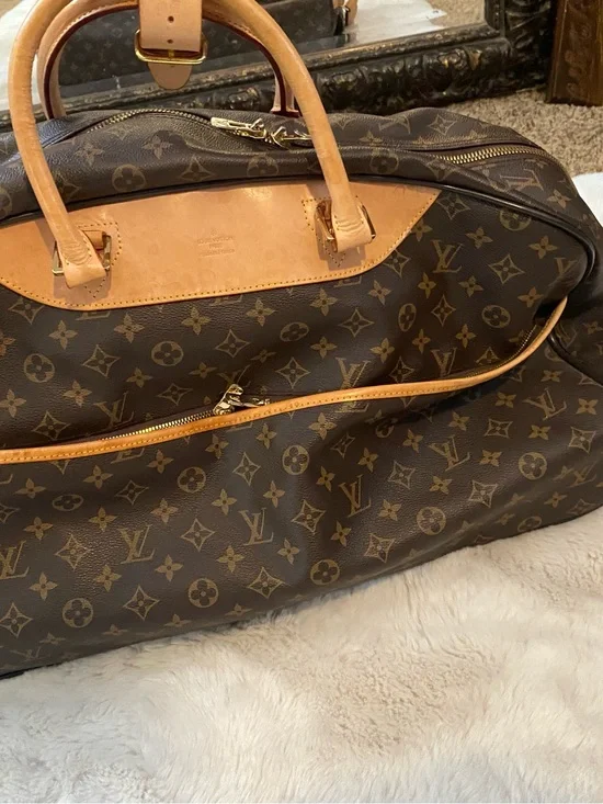 Louis Vuitton Monogram Canvas rolling Travel Bag with Natural Vachetta Trim