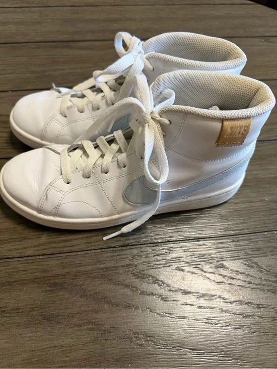 Nike White High-Top Sneakers with Light Blue Swoosh and Tan Heel Tab