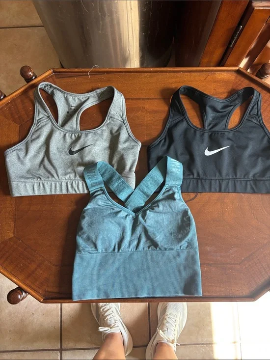 2 Nike and 1 pink Victoria’s Secret Gray Dri-FIT Racerback Sports Bra