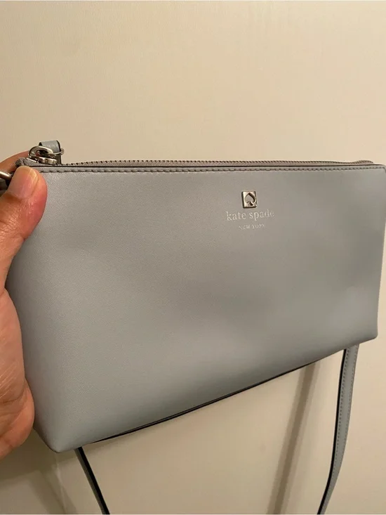 Kate Spade light gray leather crossbody bag with gold spade logo