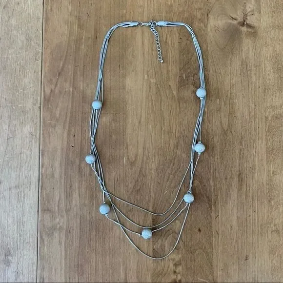 Silver colored necklace with silver beads