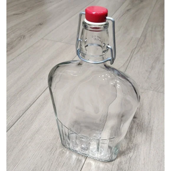 Clear Glass Swing Top Flask Decanter with‎ Red Stopper Fluted Base 25 fl oz