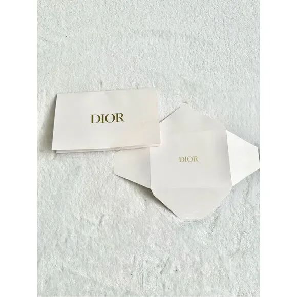 White and gold Dior envelope ￼