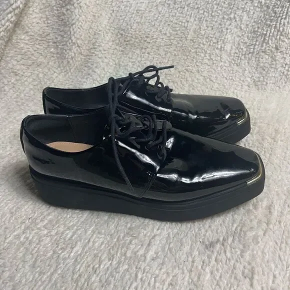 Aldo Black Patent Leather platform wedge lace up shoes SZ9 with gold accents.