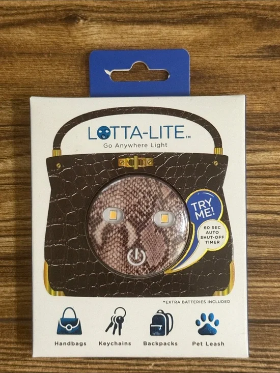 The snakeskin Lotta-Lite graphic-print LED clip-on light.