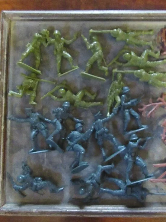 50 small plastic toys; some army men; turtles; flags; fences