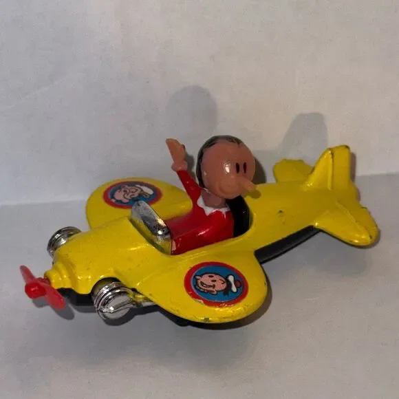 vintage 1980 Corgi Juniors Olive Oyl yellow airplane from the Popeye cartoon