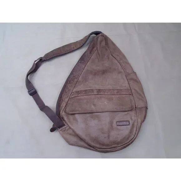 L.L. Bean brown leather sling backpack