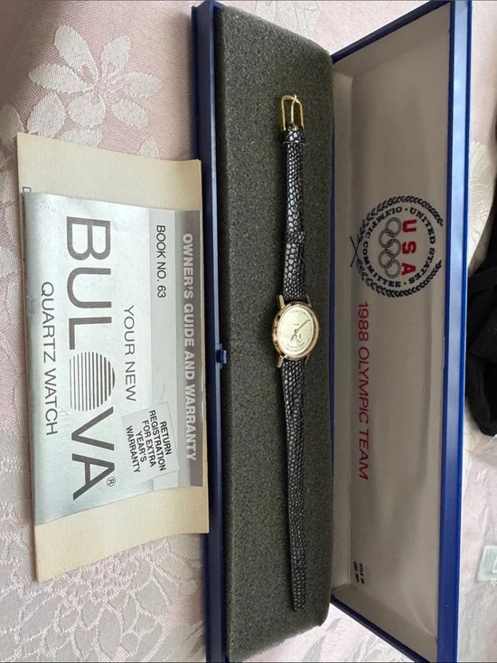 1988 Olympic Team Bulova Women's Black Strap Watch with Gold face