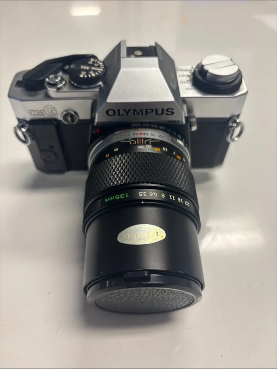 Olympus OM-G Film Camera + 135 mm lens.