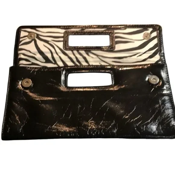 Gap black shiny clutch with zebra print inside