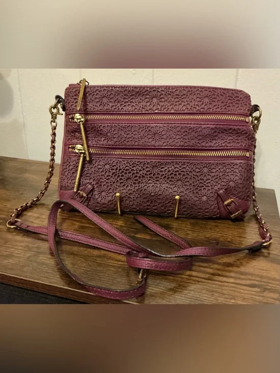 a Vintage Rare Elliott Lucca burgundy Leather laser-cut leather crossbody bag