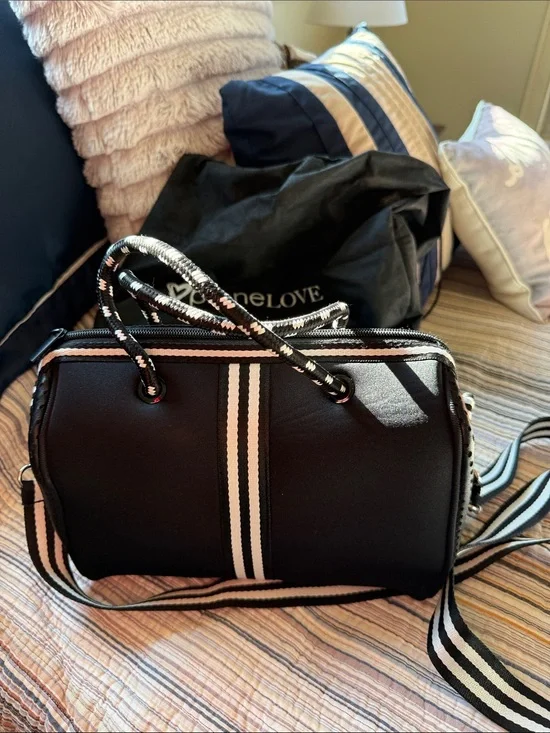 Black Crossbody Barrel Bag with Cream-Striped Accent