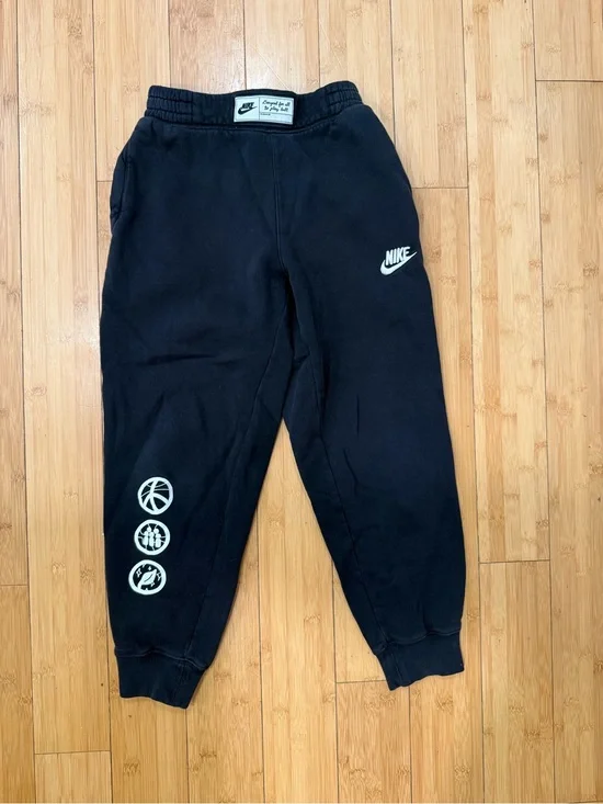 Nike Kids Black Sweatpants with White Logo and Graphic Icons,size small