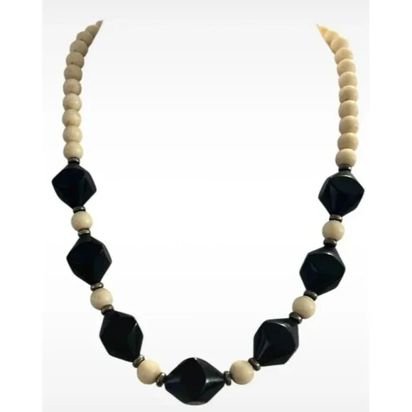 Vintage beaded necklace graduated sizes 22” long Cream and black