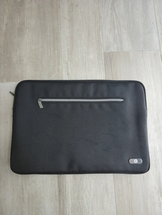 HP Black Laptop Sleeve with Front Zip Pocket and Silver Accent