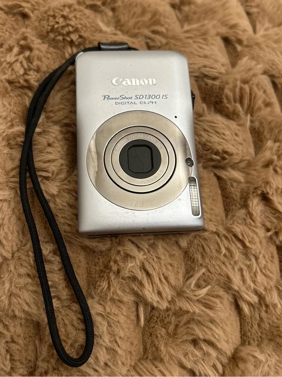 Silver Canon PowerShot SD1300 IS Digital ELPH camera. Working. Sell as is