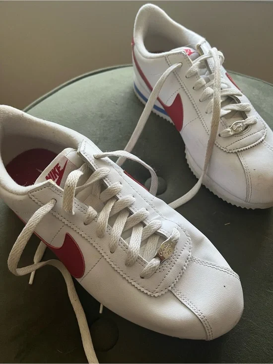 Nike Women's 8.5 White Leather Sneakers with Red Swoosh