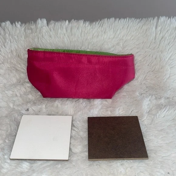 Pencil bag and 2 sample painting boards with Velcro stickers on the back .