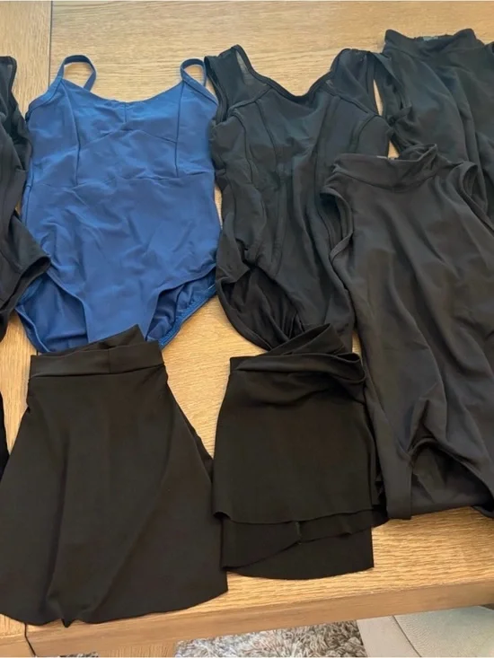 Girls size 12-14 leotards (7 leos) and 3 skirts.