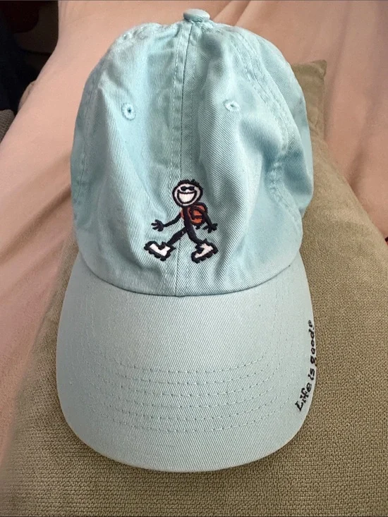 Life Is Good light blue dad hat with rollerblading stick-figure